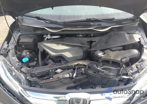 2020 Honda Odyssey Touring z USA, uszkodzony, nr VIN 5FNRL6H83LB033947